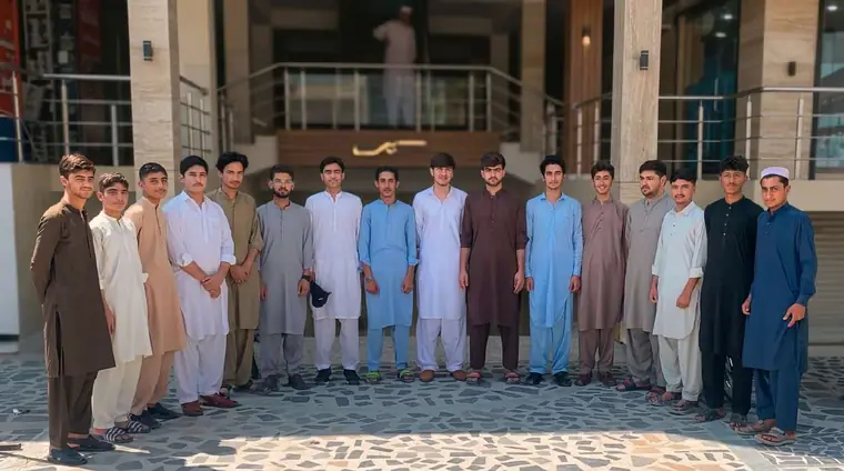 Trainees gathered outside the building at the KISI practical training area
